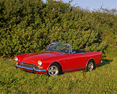 AUT 22 RK1120 02
1967 Sunbeam Tiger MKII Convertible Red 3/4 Side View On Grass