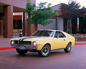 AUT 22 RK1178 02
1968 AMC AMX Yellow 3/4 Front View By Building