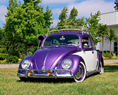 AUT 22 RK1209 03
1964 VW Bug Purple And White With Roof Rack And Swamp Cooler Low 3/4 Front View On Grass By Trees