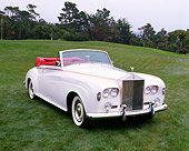 AUT 22 RK1218 06
1963 Rolls-Royce Silver Cloud III Convertible White 3/4 Front View On Grass Trees Background