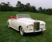 AUT 22 RK1218 07
1963 Rolls-Royce Silver Cloud III Convertible White 3/4 Front View On Grass Trees Background