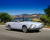 AUT 22 RK1243 03
1966 VW Type 3 Karmann Ghia Light Blue 3/4 Front View On Pavement Trees And Mountains