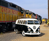 AUT 22 RK1264 09
1964 Volkswagen Bus Black And White Front 3/4 View On Dirt By Train