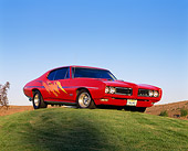 AUT 22 RK1270 02
1968 Pontiac GTO Red Custom Design Low 3/4 Front View On Grass Hill