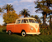 AUT 22 RK1278 05
1967 VW Crew Cab With Sunroof Peach And White 3/4 Side View On Grass By Trees Blue Sky