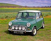 AUT 22 RK1288 01
1964 Austin Mini Cooper Green White Top 3/4 Front View On Grass Field