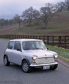 AUT 22 RK1308 02
1968 Morris Mini 1000 Union Jack Top Silver 3/4 Front View On Pavement By Fence