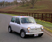 AUT 22 RK1308 07
1968 Morris Mini 1000 Union Jack Top Silver 3/4 Front View On Pavement By Fence