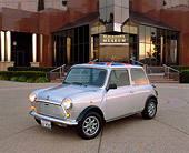 AUT 22 RK1312 02
1968 Morris Mini 1000 Union Jack Top Silver 3/4 Side View On Pavement By Building