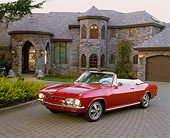 AUT 22 RK1318 04
1966 Chevrolet Corvair Turbo Corsa Convertible Red 3/4 Front View On Driveway By House