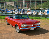 AUT 22 RK1370 01
1964 Chevrolet Corvair Monza Spyder Red 3/4 Front View On Dirt By Marina