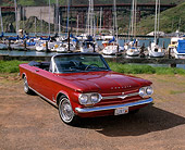 AUT 22 RK1370 02
1964 Chevrolet Corvair Monza Spyder Red 3/4 Front View On Dirt By Marina