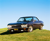 AUT 22 RK1377 05
1965 Chevrolet Corvair Corsa Coupe Turbo Blue 3/4 Front View On Grass Hill Blue Sky