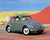 AUT 22 RK1389 04
1963 VW Bug Gray With Roof Rack And Swamp Cooler 3/4 Side View By Fence