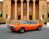 AUT 22 RK1405 01
1968 Pontiac Firebird Orange 3/4 Front View On Pavement By Building