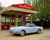 AUT 22 RK1435 02
1966 Volkswagen Karmann Ghia Type II Light Blue 3/4 Side View By Antique Gas Station