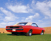 AUT 22 RK1481 04
1968 Dodge Charger Red White Top Low 3/4 Rear View On Grass Blue Sky
