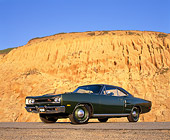 AUT 22 RK1498 02
1969 Dodge Hemi Coronet RT Green Low 3/4 Side View On Pavement Against Rock
