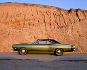 AUT 22 RK1500 05
1969 Dodge Hemi Coronet RT Green Profile On Pavement Against Rock