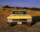 AUT 22 RK1524 02
1966 Chevrolet Chevelle SS Modified Yellow Head On Shot On Gravel By Field Of Flowers