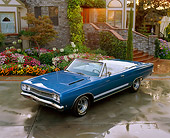 AUT 22 RK1538 02
1968 Plymouth GTX 440 Convertible Blue Overhead Front 3/4 View On Wet Pavement By House