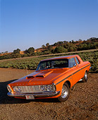AUT 22 RK1540 04
1963 Plymouth Belvedere 426 Max Wedge Orange 3/4 Front View On Dirt By Open Field