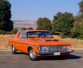 AUT 22 RK1542 03
1963 Plymouth Belvedere 426 Max Wedge Orange 3/4 Front View On Pavement By Trees