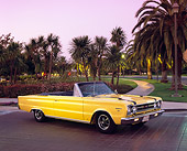 AUT 22 RK1554 01
1967 Plymouth GTX Convertible Yellow 3/4 Side View On Driveway By Palm Trees