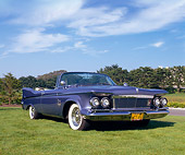 AUT 22 RK1556 03
1961 Imperial Crown Convertible Blue Low 3/4 Front View On Grass Blue Sky