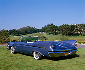 AUT 22 RK1558 02
1961 Imperial Crown Convertible Blue 3/4 Rear View On Grass Blue Sky