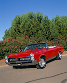 AUT 22 RK1563 01
1967 Pontiac GTO Convertible Red Slanted 3/4 Front View On Pavement By Trees And Bushes