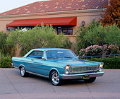 AUT 22 RK1590 02
1965 Ford Galaxie 500 Turquoise 3/4 Front View On Pavement By Trees And Flowers