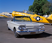AUT 22 RK1608 05
1963 Corvair Monza Convertible White 3/4 Front View On Pavement By Yellow Airplane