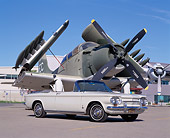AUT 22 RK1611 03
1963 Corvair Monza Convertible White Low 3/4 Side View On Pavement By Military Airplane