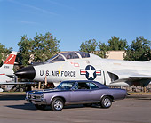 AUT 22 RK1614 03
1967 Pontiac GTO Metallic Blue 3/4 Side View On Pavement By Military Airplane