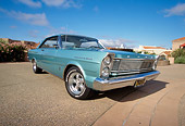 AUT 22 RK1621 01
1965 Ford Galaxie 500 Turquoise Low 3/4 Front View On Pavement Blue Sky