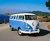 AUT 22 RK1637 01
1967 Volkswagen Split Window Bus Blue And White 3/4 Front View On Pavement Water And Trees Background