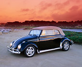 AUT 22 RK1642 02
1963 VW Bug Convertible Black 3/4 Side View On Beach Trees Background Filtered