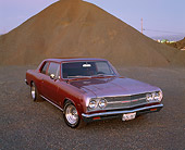 AUT 22 RK1684 01
1965 Chevy Chevelle Modified Bronze With Flames Front 3/4 View On By Dirt Hill At Dusk