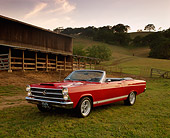 AUT 22 RK1702 03
1966 Ford Fairlane GTA Convertible Red 3/4 Front View On Grass By Barn