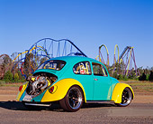 AUT 22 RK1756 03
1966 Volkswagen Beetle Green And Yellow 3/4 Rear View On Pavement By Roller Coaster