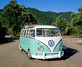 AUT 22 RK1785 02
1960 Volkswagen Deluxe 23-Window Microbus Seafoam And White 3/4 Front View By Mountains Trees