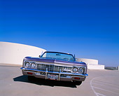 AUT 22 RK1811 01
1966 Chevrolet Impala Convertible Violet Low Slanted Head On Shot On Pavement Blue Sky
