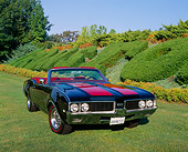 AUT 22 RK1819 03
1969 Oldsmobile 442 Convertible Red And Black Front 3/4 View On Grass