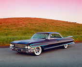 AUT 22 RK1907 06
1961 Cadillac Coupe De Ville Black Lowrider 3/4 Front View On Pavement By Grass Hill Filtered