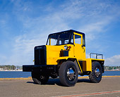 AUT 22 RK1908 11
1962 Coleman Aircraft Hauler Yellow And Black 3/4 Side View On Pavement Blue Sky