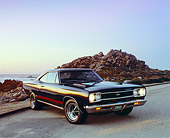 AUT 22 RK1913 02
1968 Plymouth GTX Black With Red Stripe 3/4 Front View On Pavement By Rocks Filtered