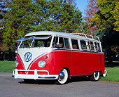 AUT 22 RK1925 01
1961 Volkswagen Van 15 Window Deluxe Type II Red And White 3/4 Front View On Pavement By Trees