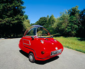AUT 22 RK1938 03
1964 Peel Trident Microcar Red 3/4 Front View On Pavement By Trees