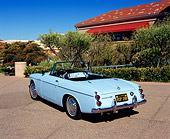 AUT 22 RK1969 03
1964 Datsun 1500 Convertible Light Blue 3/4 Rear View On Pavement By Trees